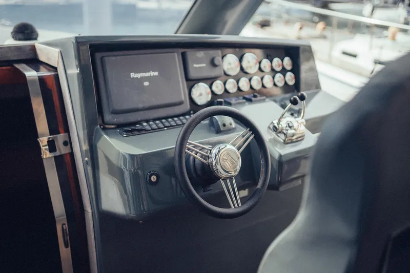 Hummingbird Yacht Photos Pics Helm of 2008 Fjord 40 Open yacht with steering wheel and control panel.