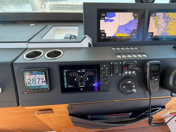 Essi Yacht Photos Pics 2019 Axopar 37 Cabin dashboard with navigation screens and controls.