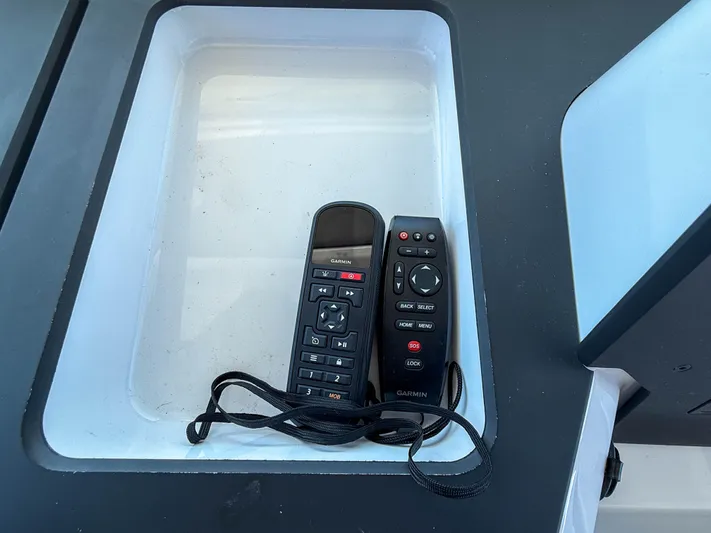 Essi Yacht Photos Pics Remote controls in storage compartment of 2019 Axopar 37 Cabin boat.