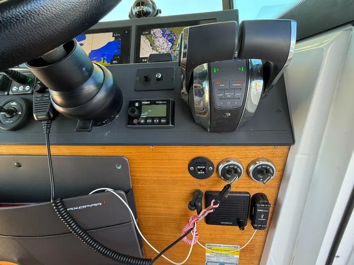 Essi Yacht Photos Pics Control panel of 2019 Axopar 37 Cabin boat with navigation and throttle controls.