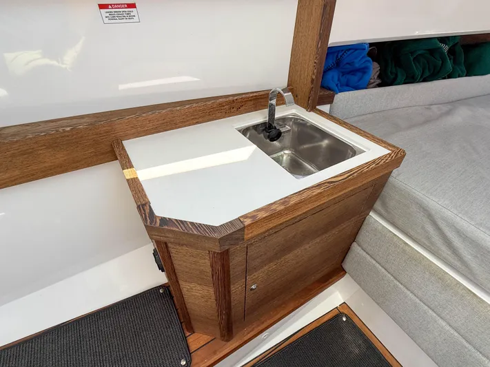 Essi Yacht Photos Pics Compact sink area in 2019 Axopar 37 Cabin boat interior.