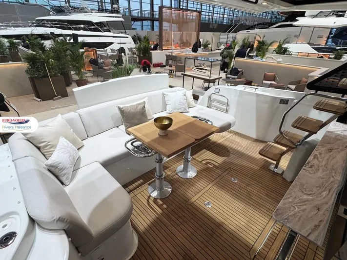  Yacht Photos Pics Luxurious Prestige F4.3 yacht interior, 2025 model, featuring elegant seating and wooden flooring.