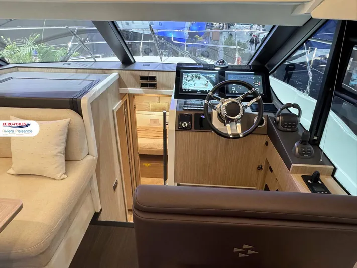  Yacht Photos Pics Interior of 2025 Prestige F4.3 yacht, featuring modern helm and luxurious seating.