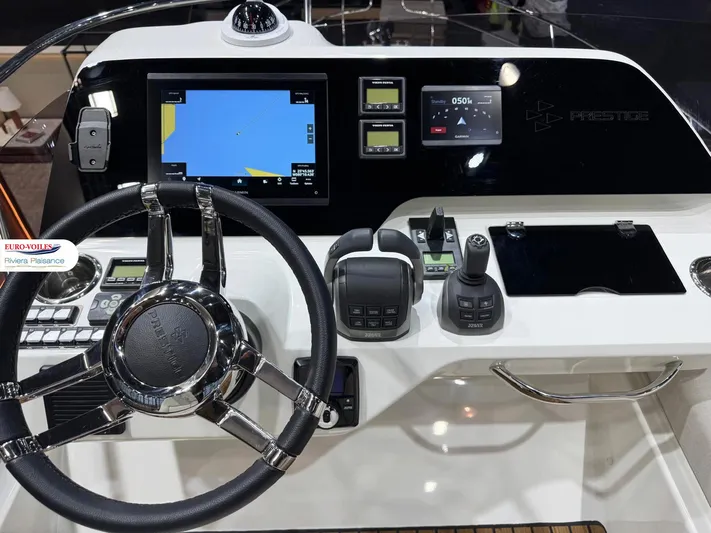  Yacht Photos Pics Helm of 2025 Prestige F4.3 yacht with advanced navigation controls and display.