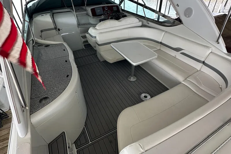  Yacht Photos Pics 2004 Formula 370 SS boat interior with white seating and table, featuring a sleek design.