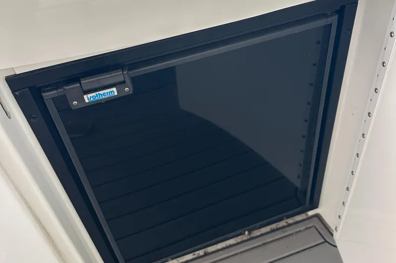  Yacht Photos Pics 2004 Formula 370 SS boat refrigerator with black door and latch.