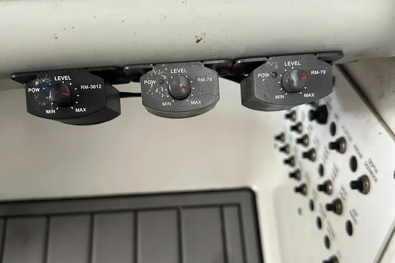  Yacht Photos Pics Control panel of a 2004 Formula 370 SS boat with level adjustment knobs.