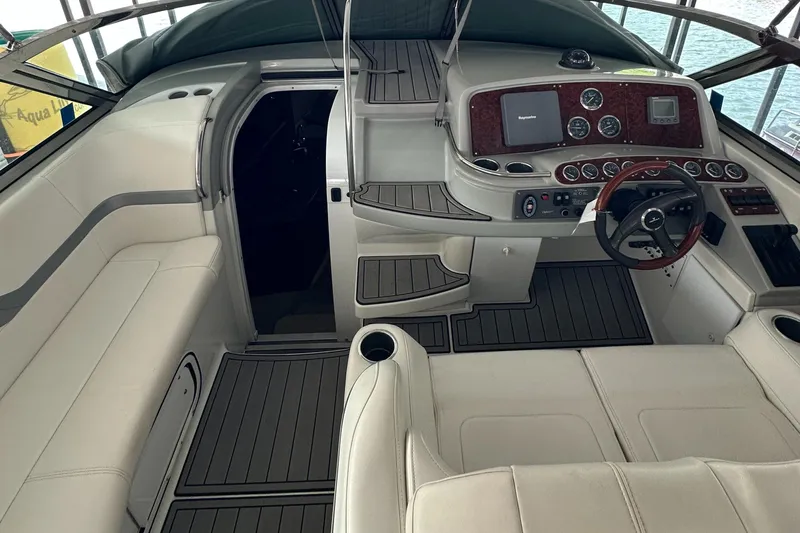  Yacht Photos Pics 2004 Formula 370 SS boat interior with white seating and modern dashboard controls.