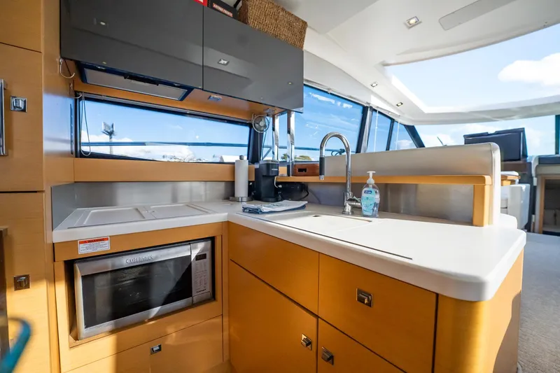 The Best Day Ever Yacht Photos Pics Luxurious kitchen area in a 2013 Prestige 500S yacht with modern amenities.