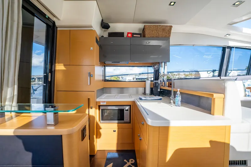 The Best Day Ever Yacht Photos Pics Luxurious interior of a 2013 Prestige 500S yacht, featuring a modern kitchen and sleek design.