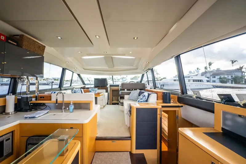 The Best Day Ever Yacht Photos Pics Luxurious interior of 2013 Prestige 500S yacht with modern kitchen and seating area.
