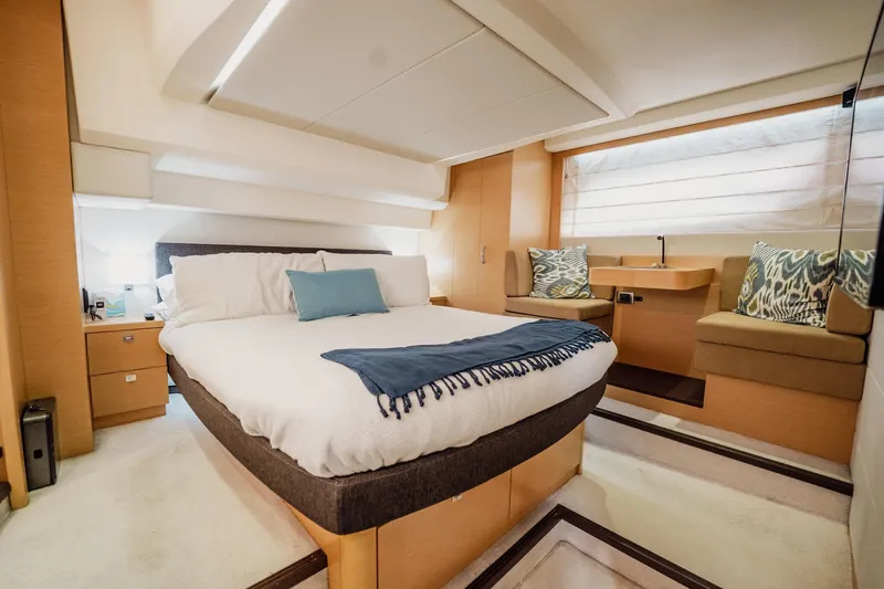 The Best Day Ever Yacht Photos Pics Luxurious bedroom interior of 2013 Prestige 500S yacht with modern design and cozy furnishings.