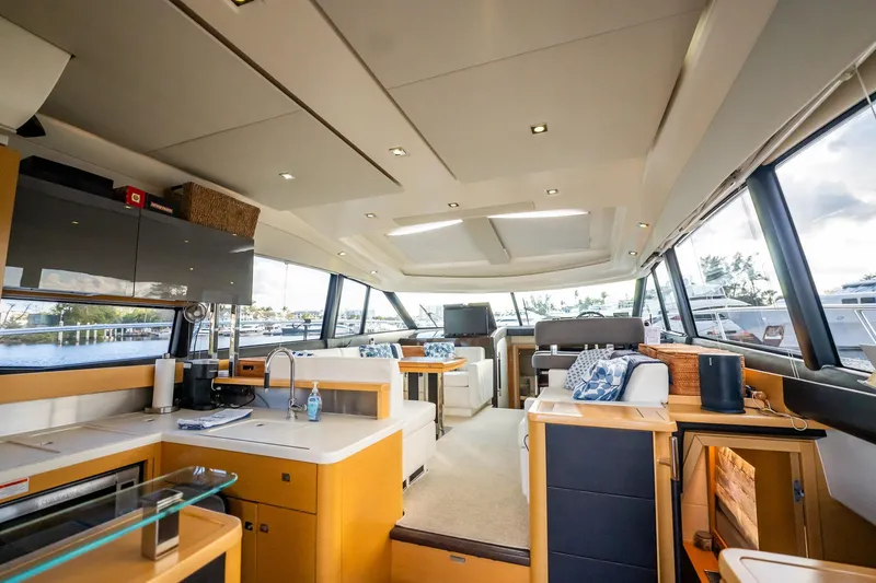 The Best Day Ever Yacht Photos Pics Luxurious interior of 2013 Prestige 500S yacht with modern kitchen and seating area.