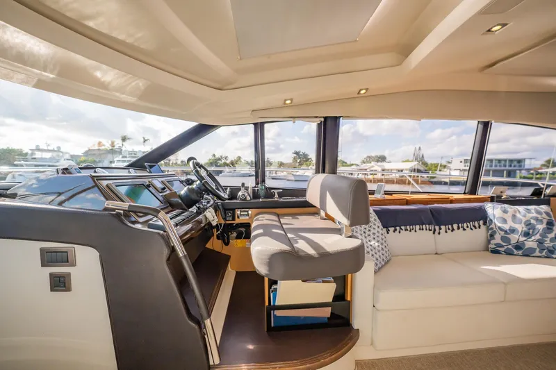 The Best Day Ever Yacht Photos Pics Luxurious interior of 2013 Prestige 500S yacht with helm and seating area.
