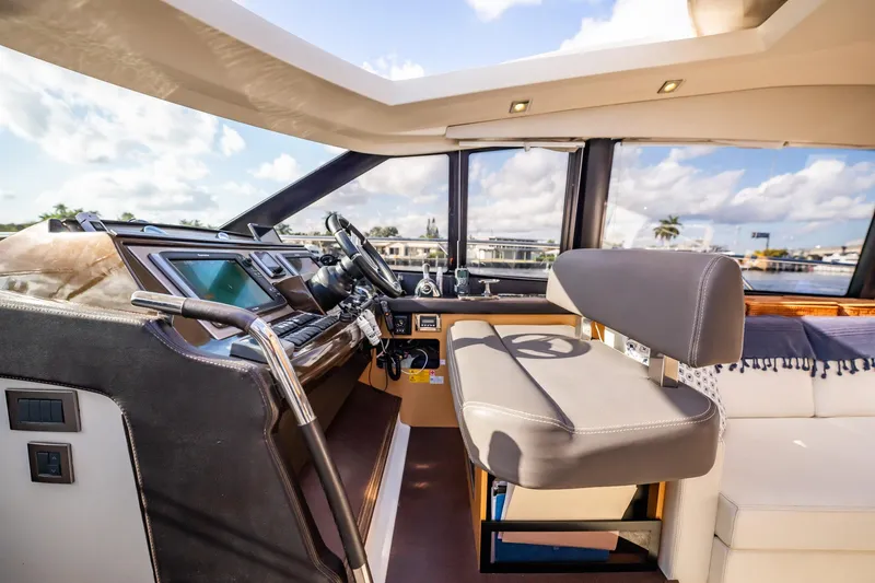 The Best Day Ever Yacht Photos Pics Luxurious interior of 2013 Prestige 500S yacht with modern helm and seating.