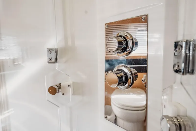 The Best Day Ever Yacht Photos Pics Control panel in 2013 Prestige 500S yacht bathroom, featuring chrome knobs and sleek design.