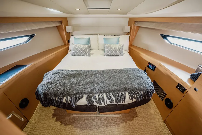 The Best Day Ever Yacht Photos Pics Luxurious cabin interior of 2013 Prestige 500S yacht with cozy bed and modern design.