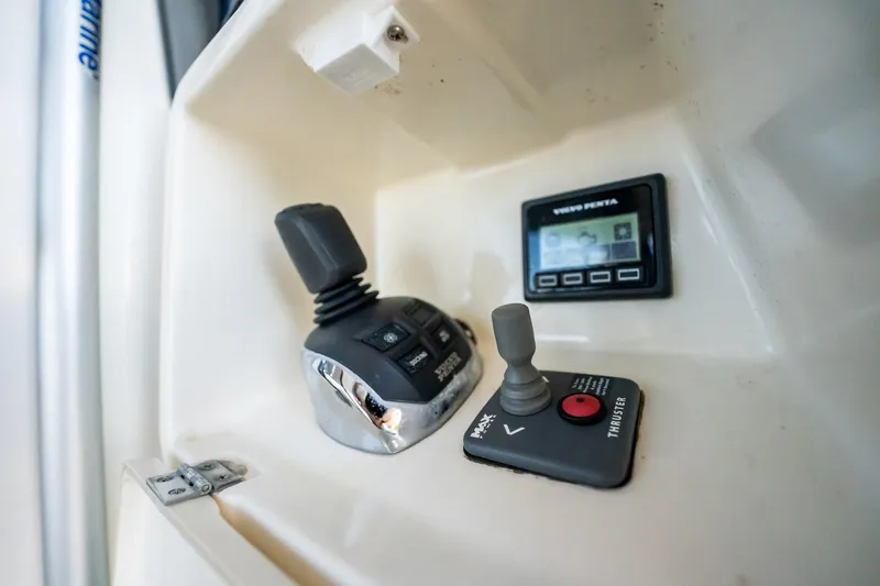 The Best Day Ever Yacht Photos Pics Control panel of a 2013 Prestige 500S yacht with joystick and display.
