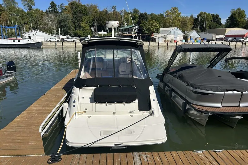  Yacht Photos Pics Sea Ray 350 Sundancer 2016 docked at marina, surrounded by other boats.