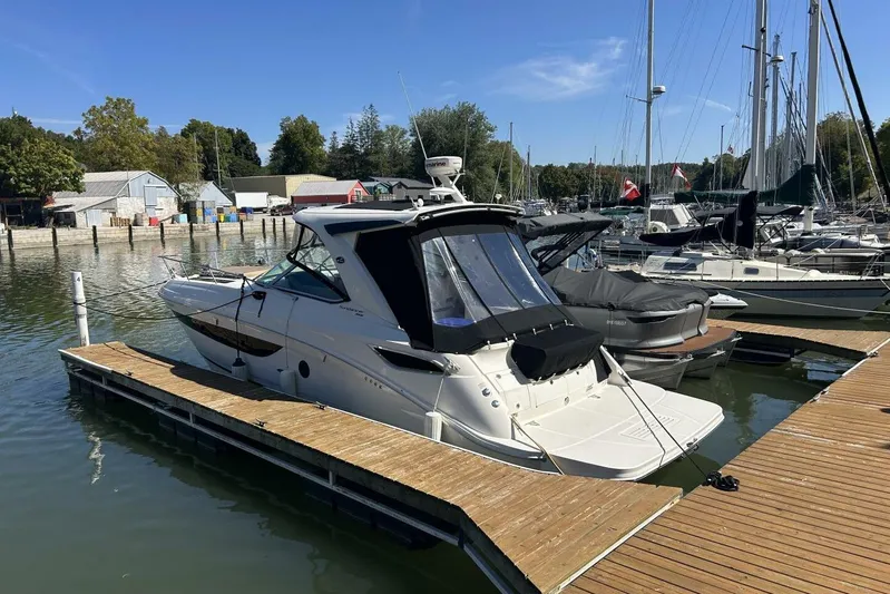  Yacht Photos Pics 2016 Sea Ray 350 Sundancer docked at a marina on a sunny day.