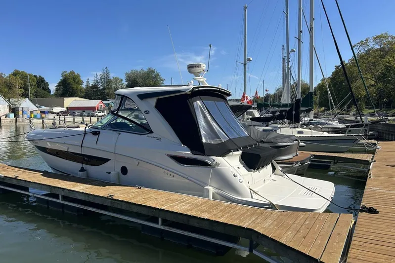  Yacht Photos Pics 2016 Sea Ray 350 Sundancer docked at marina under clear blue sky.