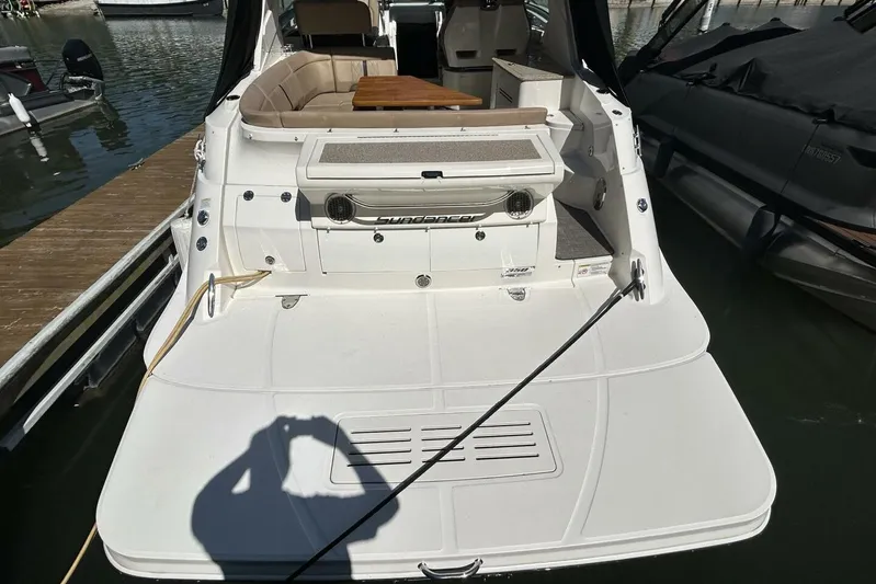  Yacht Photos Pics 2016 Sea Ray 350 Sundancer boat docked, rear view with swim platform.