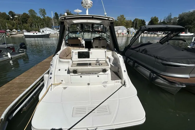  Yacht Photos Pics 2016 Sea Ray 350 Sundancer docked at marina, rear view with seating and sink.