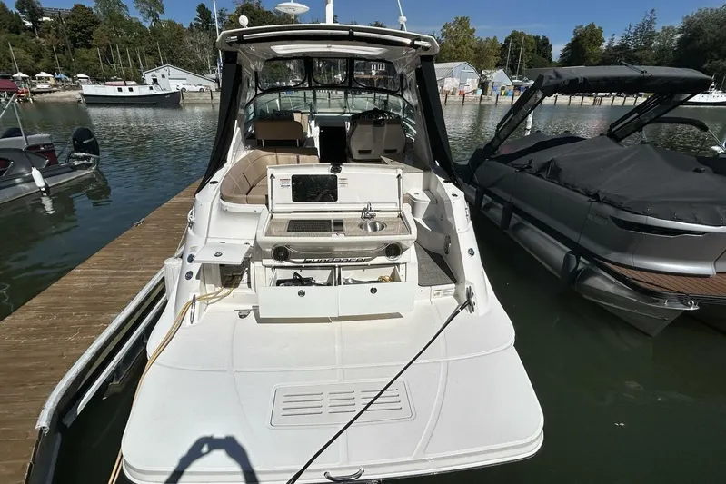  Yacht Photos Pics 2016 Sea Ray 350 Sundancer docked, featuring spacious deck and outdoor kitchenette.