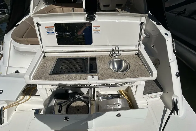  Yacht Photos Pics 2016 Sea Ray 350 Sundancer boat with outdoor kitchenette and sink.