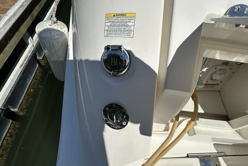  Yacht Photos Pics 2016 Sea Ray 350 Sundancer boat docked, showing fuel and waste caps.