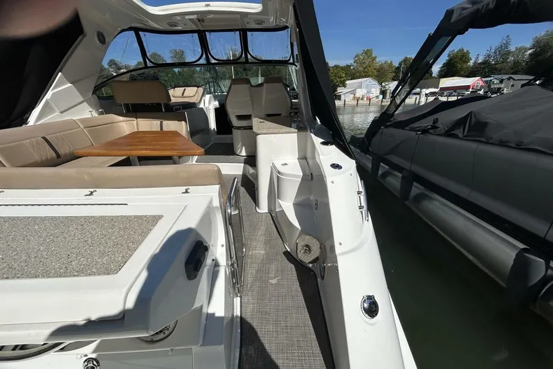  Yacht Photos Pics Interior view of 2016 Sea Ray 350 Sundancer yacht with seating and table.