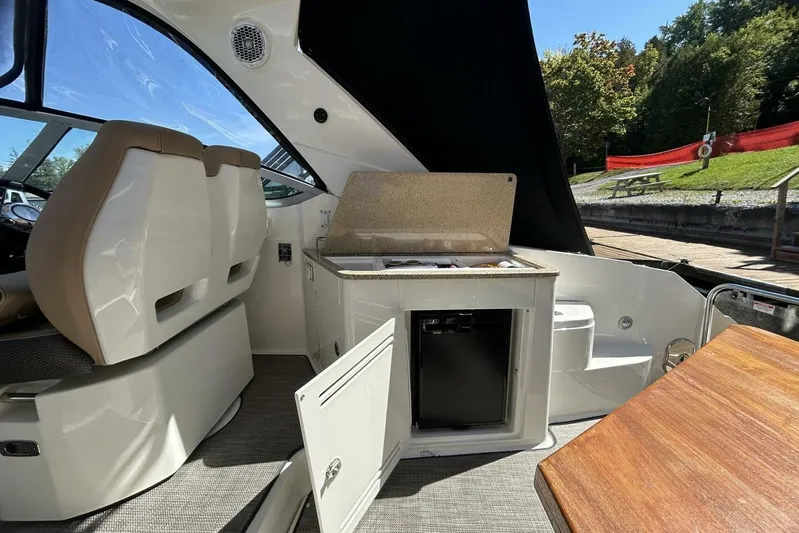  Yacht Photos Pics Interior of 2016 Sea Ray 350 Sundancer boat with seating and kitchenette.