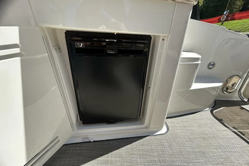  Yacht Photos Pics Built-in refrigerator on 2016 Sea Ray 350 Sundancer boat, open compartment view.