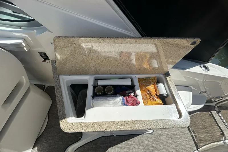  Yacht Photos Pics Storage compartment on a 2016 Sea Ray 350 Sundancer boat with snacks and supplies.