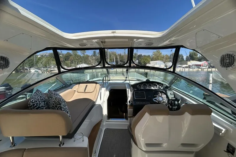  Yacht Photos Pics Interior view of 2016 Sea Ray 350 Sundancer yacht with helm and seating area.