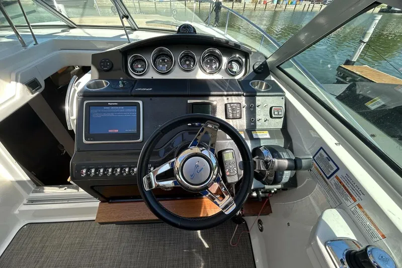  Yacht Photos Pics 2016 Sea Ray 350 Sundancer helm with modern controls and navigation system.