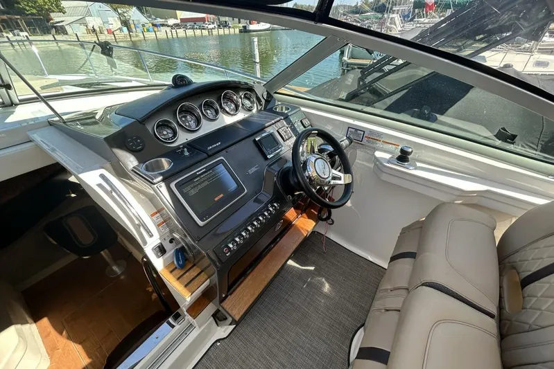  Yacht Photos Pics 2016 Sea Ray 350 Sundancer helm with modern controls and comfortable seating.