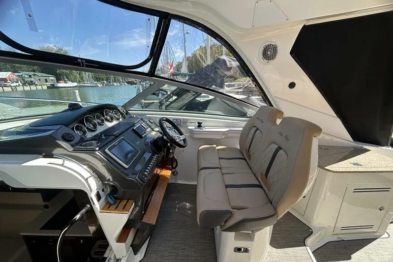  Yacht Photos Pics 2016 Sea Ray 350 Sundancer cockpit with modern controls and comfortable seating.