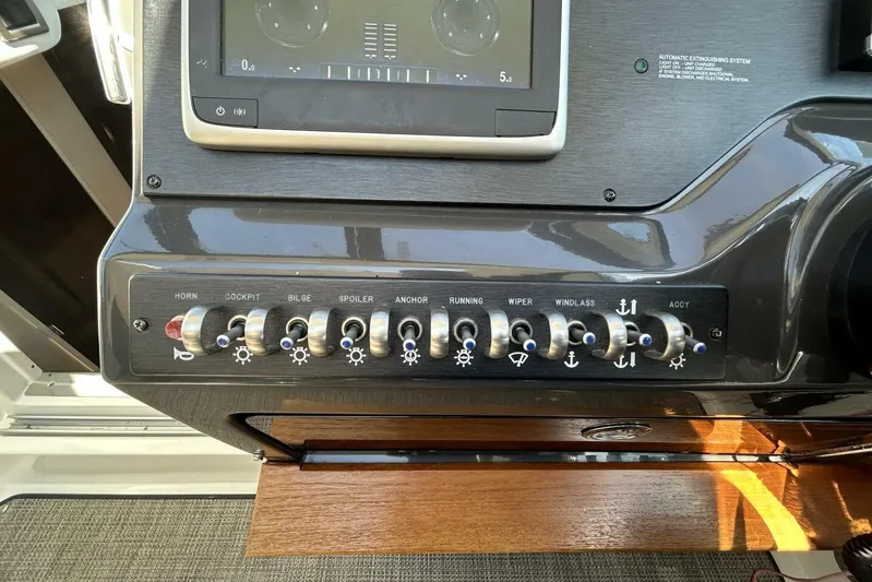  Yacht Photos Pics Control panel of a 2016 Sea Ray 350 Sundancer boat with labeled switches.