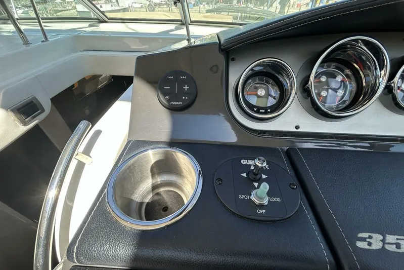  Yacht Photos Pics Control panel of 2016 Sea Ray 350 Sundancer boat with gauges and cup holder.