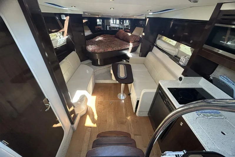  Yacht Photos Pics Interior of 2016 Sea Ray 350 Sundancer yacht with modern seating and kitchenette.