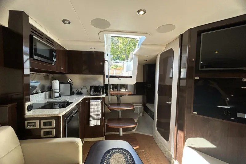  Yacht Photos Pics Luxurious interior of 2016 Sea Ray 350 Sundancer yacht with modern kitchen and entertainment area.