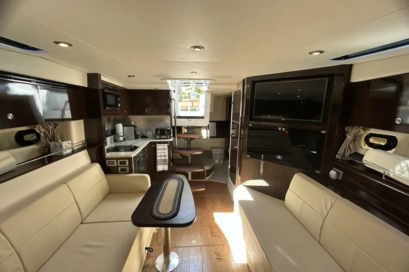  Yacht Photos Pics Luxurious interior of 2016 Sea Ray 350 Sundancer yacht with modern amenities and elegant design.