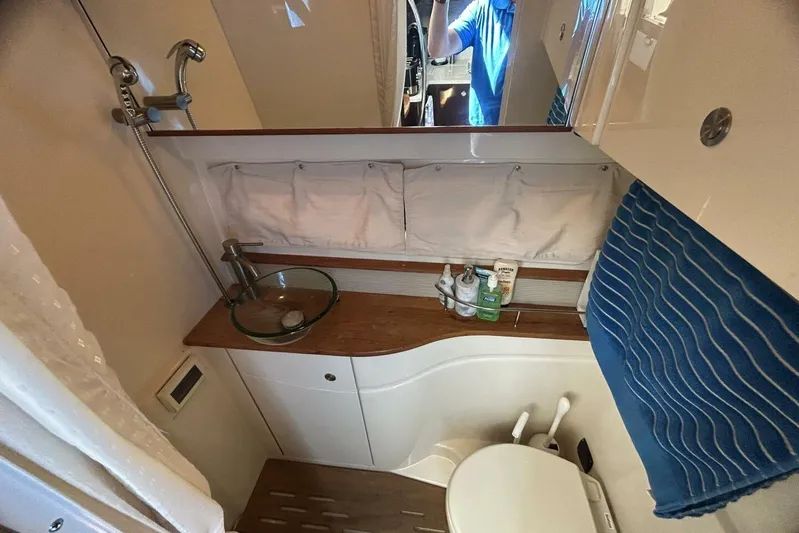  Yacht Photos Pics 2016 Sea Ray 350 Sundancer bathroom with modern fixtures and compact design.