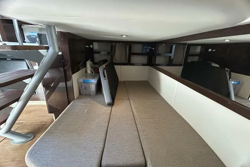  Yacht Photos Pics Interior cabin of 2016 Sea Ray 350 Sundancer with seating and storage.