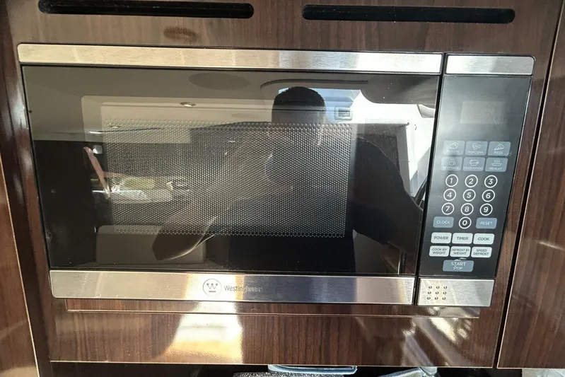  Yacht Photos Pics Built-in microwave in 2016 Sea Ray 350 Sundancer yacht kitchen.