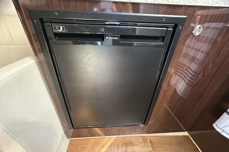  Yacht Photos Pics Compact Dometic fridge in 2016 Sea Ray 350 Sundancer yacht interior.