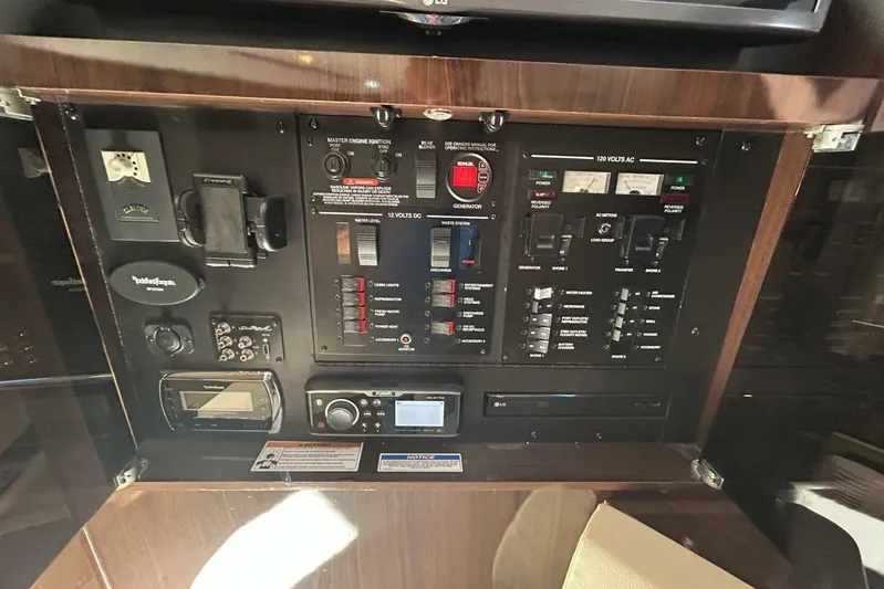  Yacht Photos Pics Control panel of a 2016 Sea Ray 350 Sundancer boat, featuring various switches and gauges.