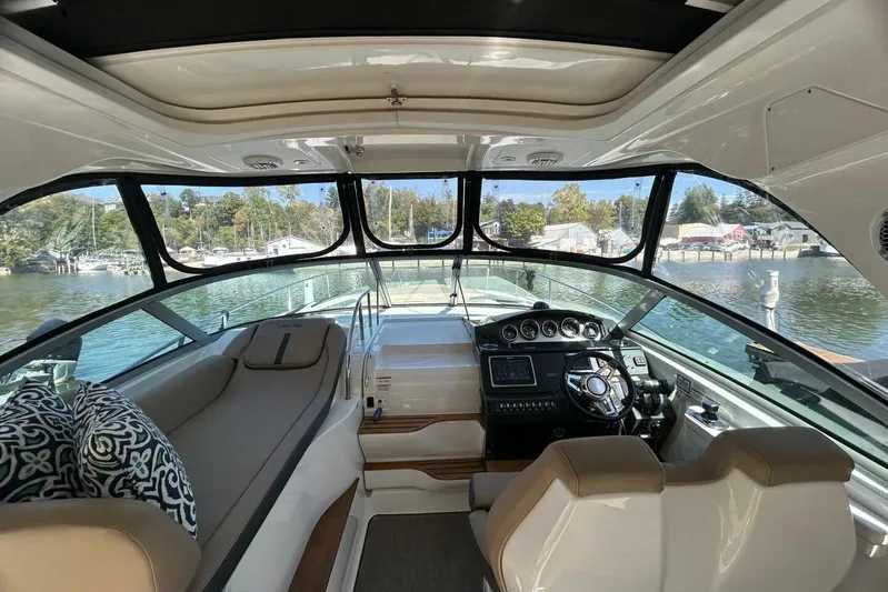  Yacht Photos Pics Interior view of 2016 Sea Ray 350 Sundancer yacht with helm and seating area.