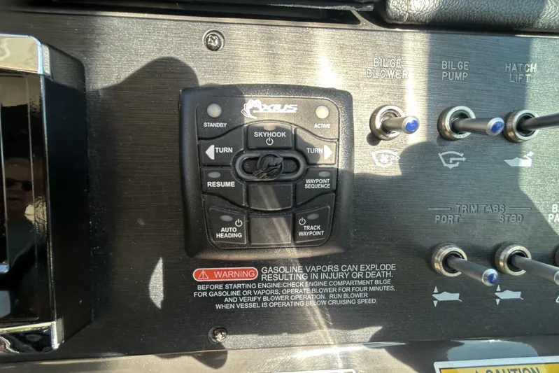  Yacht Photos Pics Control panel of a 2016 Sea Ray 350 Sundancer boat with various switches and warning label.